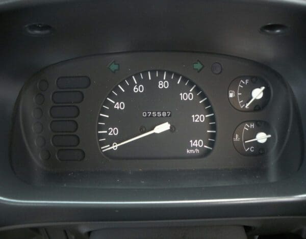 A close up of the speedometer and gauges on a car