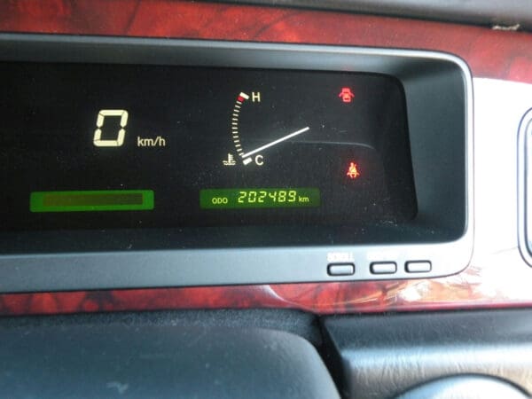 A car dashboard showing the fuel level and other information.