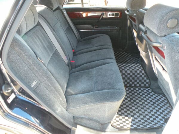 A car with the seats folded down and the back seat folded up.