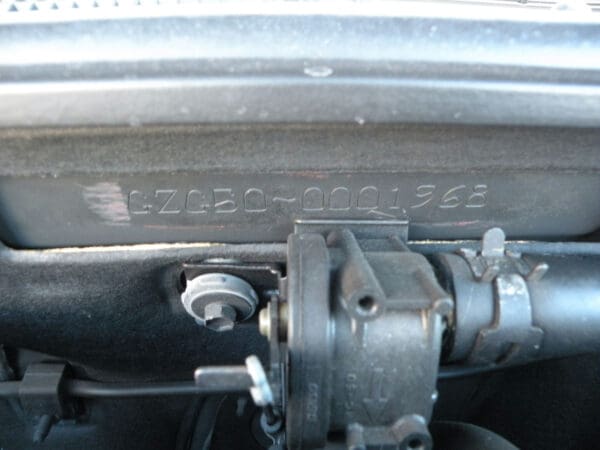 A close up of the front wheel drive on a car.