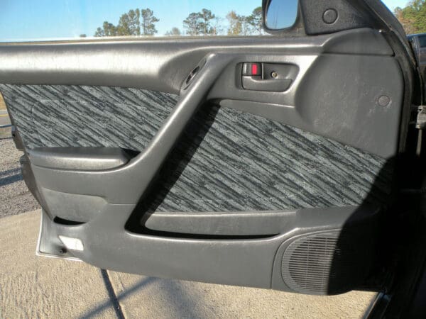 A car door with some grey and black stripes