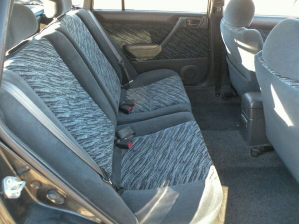 A car with grey seats and gray carpet.