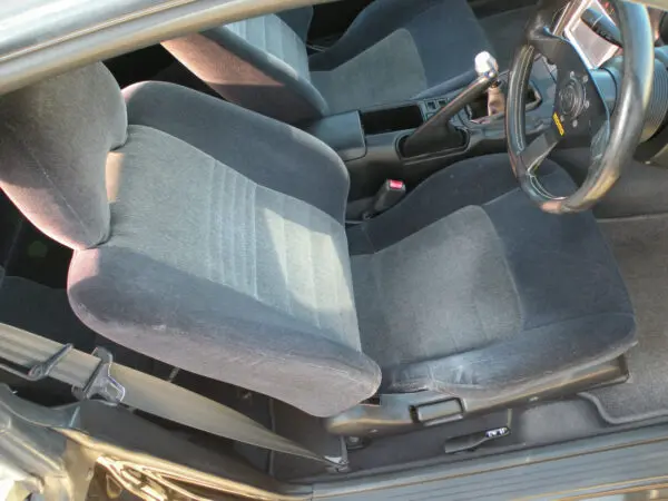 A car seat is shown in the middle of the floor.