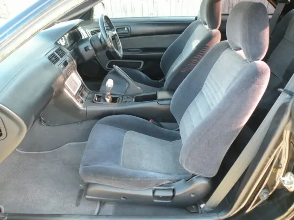 A car with grey seats and gray leather.