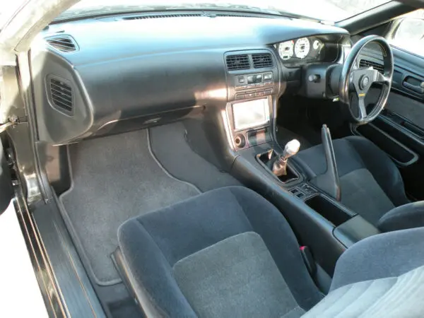 A car with the dashboard and steering wheel turned down.