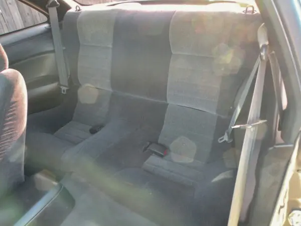 A car seat that is dirty and has been cleaned.