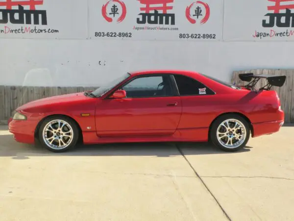 Red Japanese sports car with a spoiler.