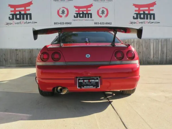 Red Japanese sports car rear view.