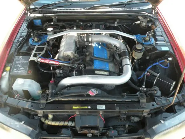 Close up of a car engine bay.