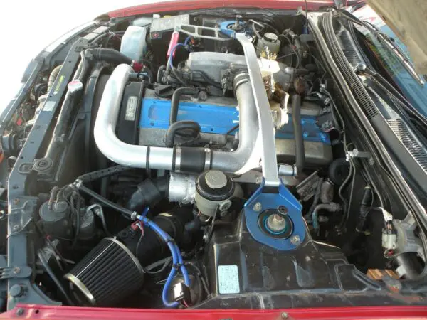 Close up of a car engine bay.