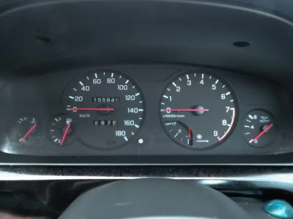 Car dashboard with speedometer and gauges.