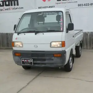 White 4WD pickup truck with a bed.