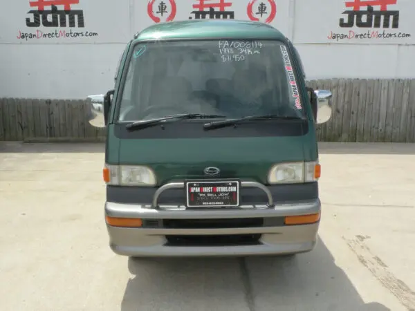 Green van front view with bumper.