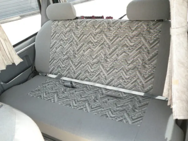 Grey patterned car seats with headrests.