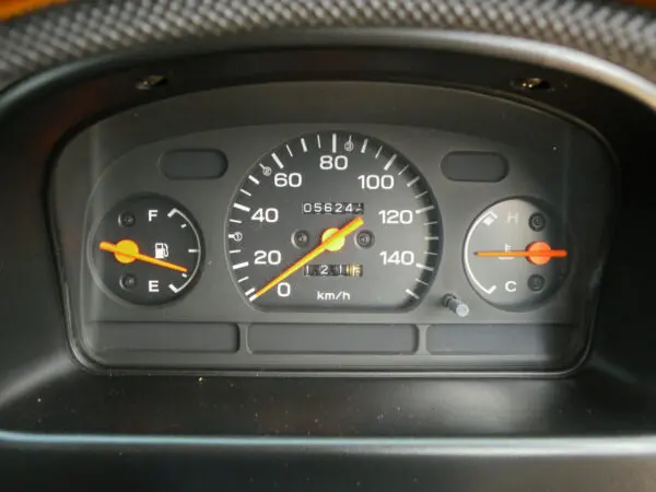 Car dashboard with speedometer and gauges.