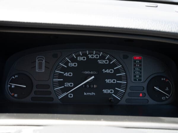 Car dashboard with speedometer and gauges.