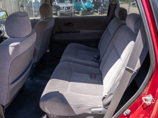 Red car interior with grey seats.