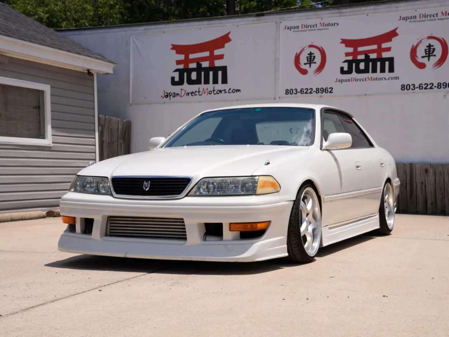 White Toyota Mark II JZX100 sedan