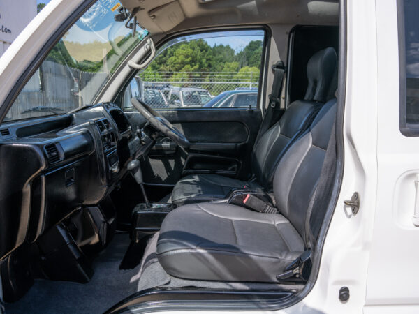 White van interior with black seats.