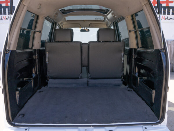 Empty cargo area of a white van.