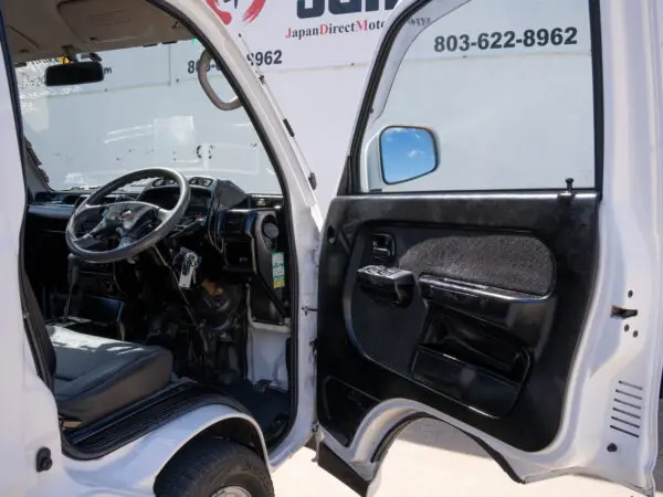 White van interior with open door.