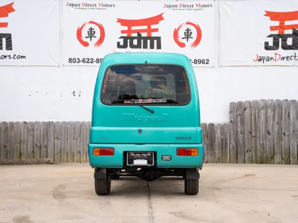 Teal Daihatsu Midget II van