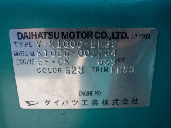 Daihatsu car identification plate with details.