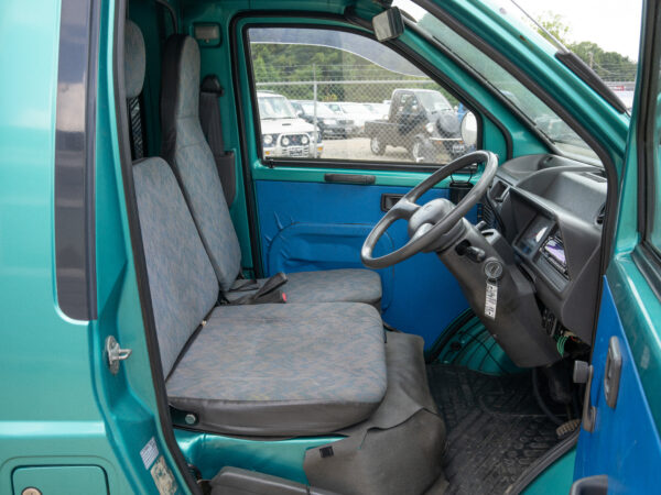 Green van's driver's side interior.