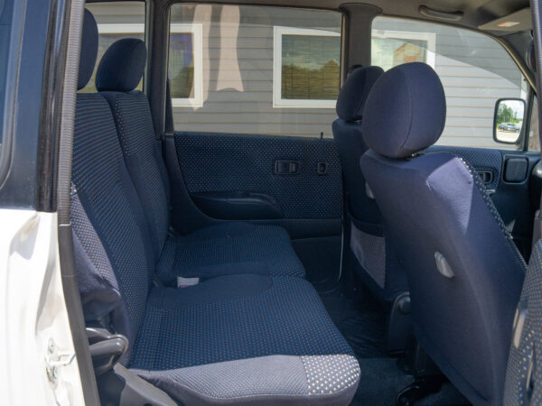 White car's backseat with blue fabric.