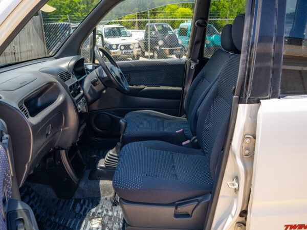 White car interior with blue seats.