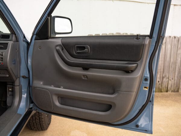 Open car door with black interior.