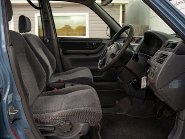 Gray car interior with driver's seat.