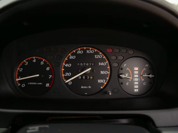 Car dashboard with speedometer and gauges.