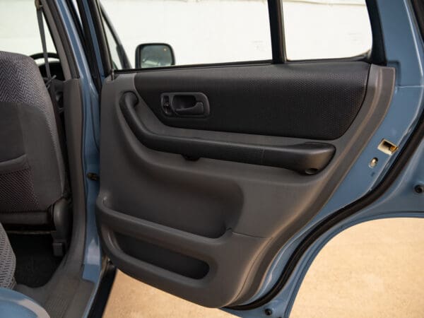 Open car door with black interior.