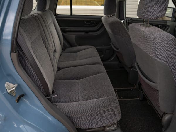 Grey fabric seats in a car interior.