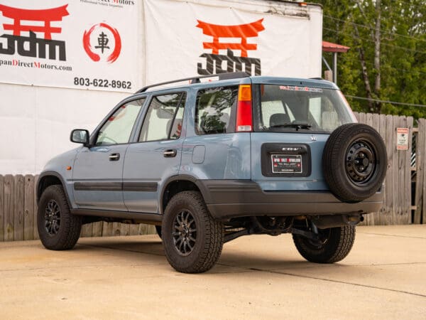 Gray Honda CR-V with black wheels.