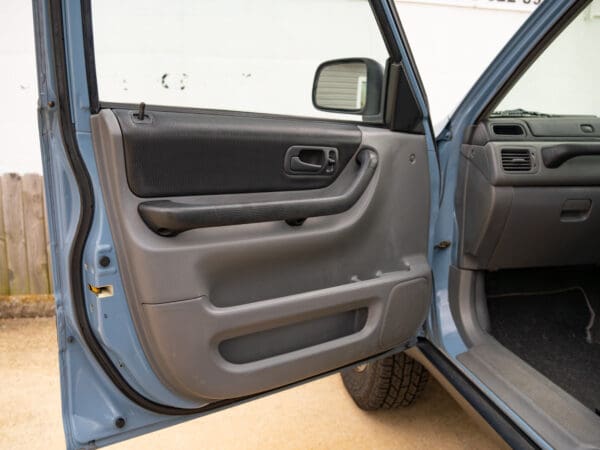 Open car door with black interior.