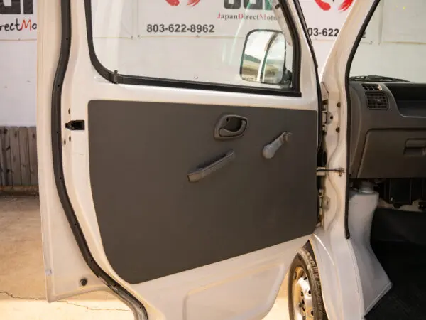 White van with open door and interior view.