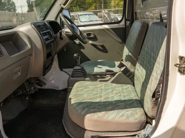 White van interior with patterned seats.