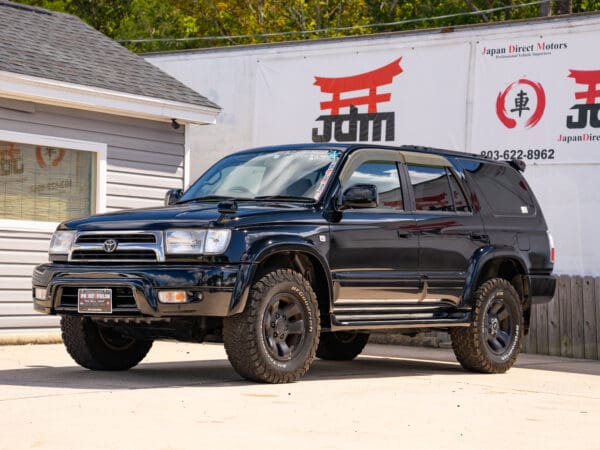 Black Toyota Land Cruiser SUV parked.