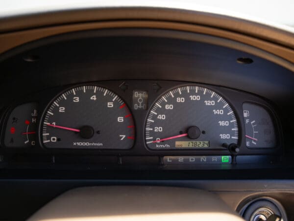 Car dashboard with speedometer and gauges.