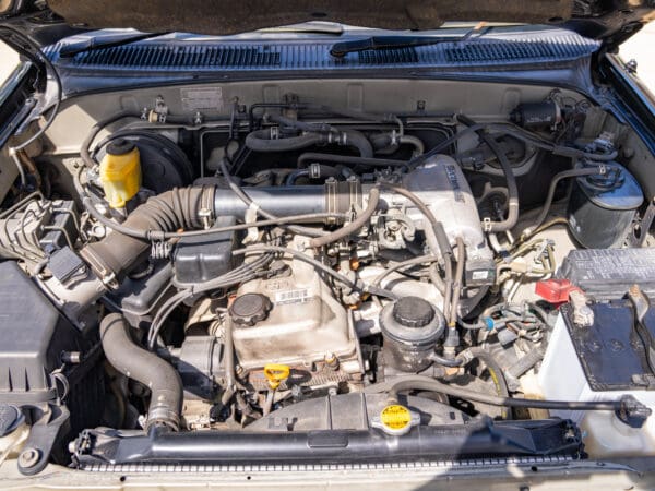 Open hood revealing a car engine.