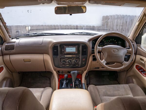 Tan leather interior of a Toyota Land Cruiser.