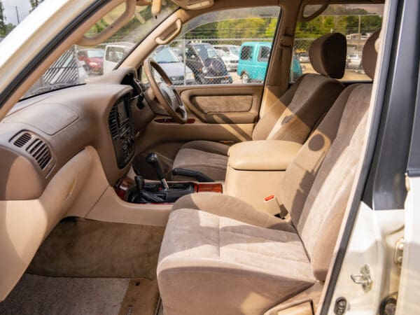 Beige interior of a white SUV.