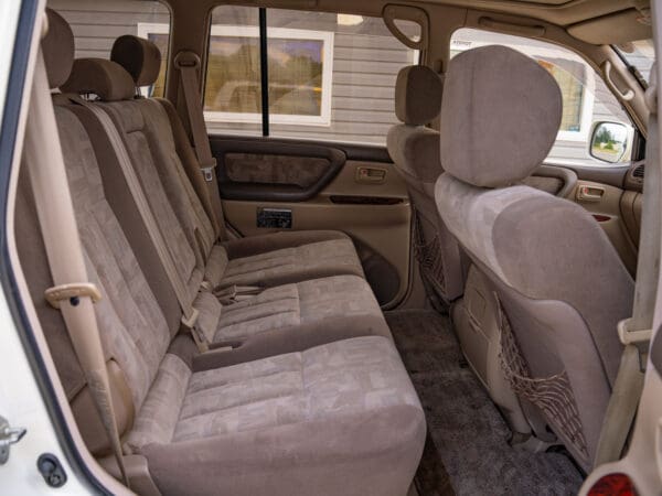 Beige leather back seats of SUV.