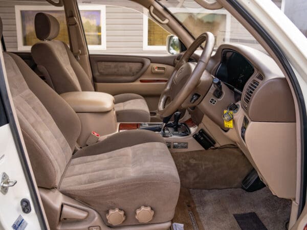 Beige leather interior of a white SUV.