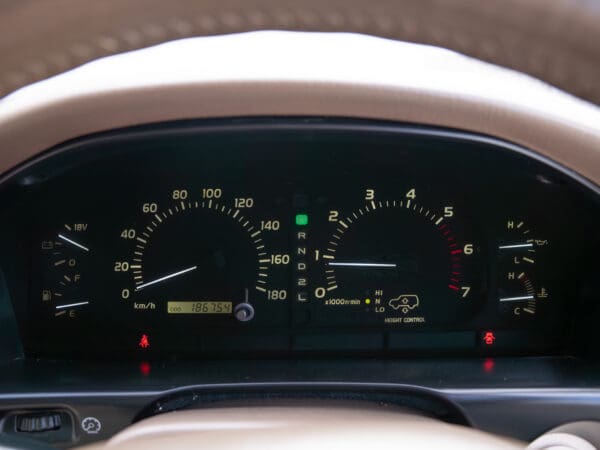 Car dashboard with speedometer and gauges.