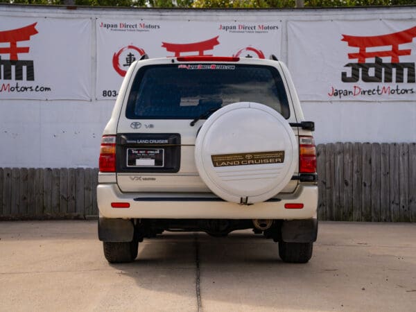 White Toyota Land Cruiser rear view.