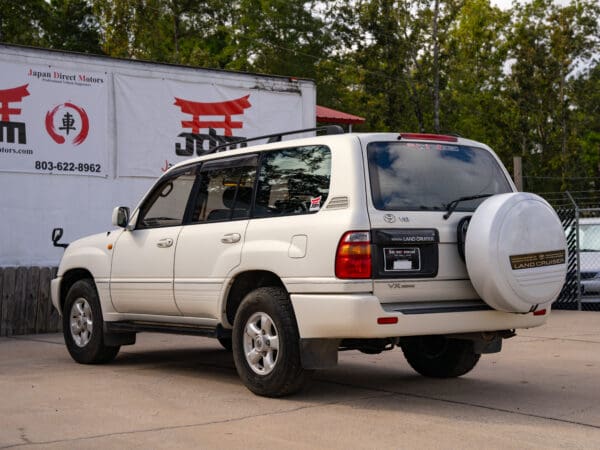 White Toyota Land Cruiser SUV rear view.