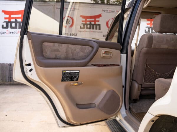 White Toyota Land Cruiser interior door open.